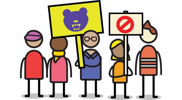 A group of protestors holding anti-bear signs, and a group of protestors with pro-bear signs.